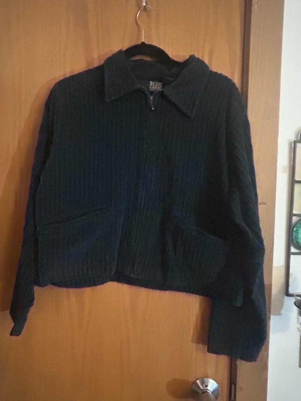Dark green corduroy jacket with zipper and pockets. Size: L but fits smaller #co
